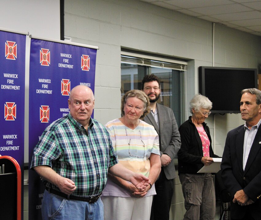 CEREMONY OF GRATITUDE: Thomas McKenna and his wife, Mary, express their appreciation for the Warwick Fire Department as they describe the events of May 9.