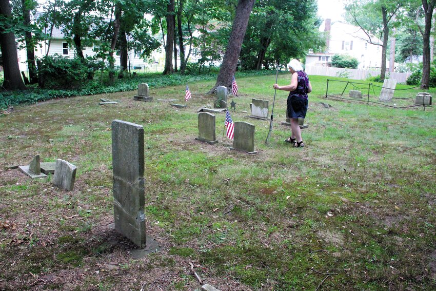 NOT FAR FROM HOME: As a child Pegee Malcolm remembers the cemetery close to home and reading the inscriptions on the grave markers and wondering what those people were like. When she returned to live in the house where she grew up, Malcolm found that the cemetery was totally obscured by overgrowth. She adopted it and cleared it.