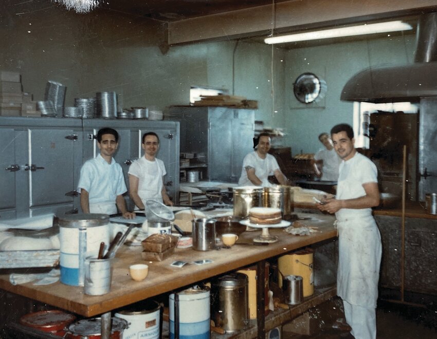 BACK IN TIME: In this undated photo from the Solitro family, the four sons of founder Michael Solitro &mdash; from left to right, Larry, Michael II, Armando, and George &mdash; work hard in the bakery. Together, they carried on the business. (Photo courtesy the Solitro family)