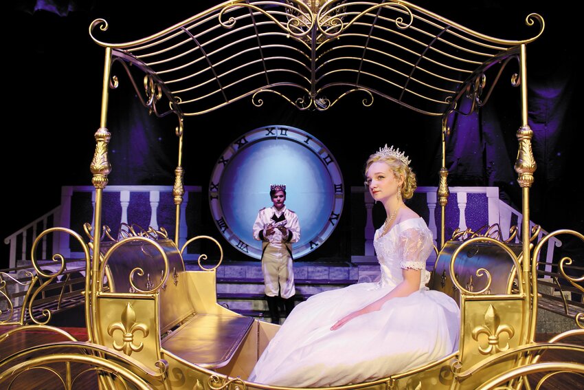 SHE LEFT HER GLASS SLIPPER BEHIND: Cinderella (Sadie Schenenga, 14, of East Greenwich) rides off in her golden carriage while the Prince (Keegan Carson, 15, of West Warwick) holds up her glass slipper she left on the steps of the palace. (Warwick Beacon photos)