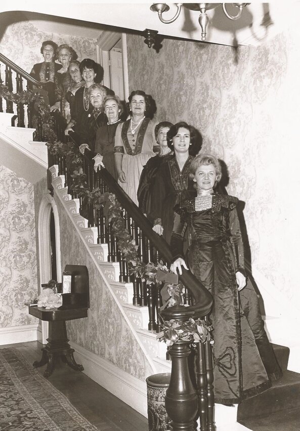 DECKED OUT IN FINERY: This picture, taken circa 1967, shows Cranston Historical Society members decked out in finery for an open house at the Sprague Mansion. (Photo courtesy Cranston Historical Society)