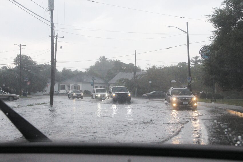 RIVER ROAD: Seeking to find higher ground vehicles using West Shore Road during Monday&rsquo;s storm often left their lane to drive into oncoming traffic. This image was taken near the intersection with Tidewater Drive. (Warwick Beacon photo)