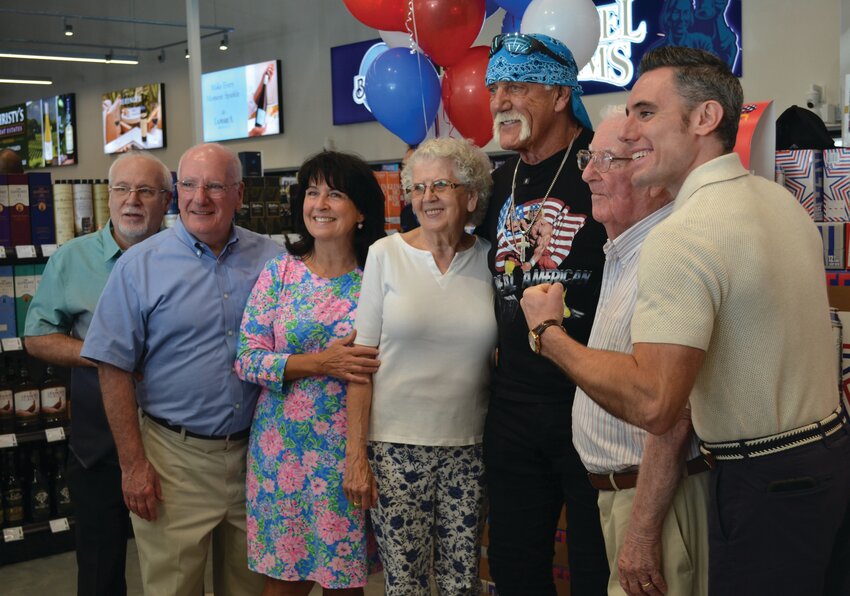 HULK THE HAWKER: WWE Hall of Fame wrestler and American legend Hulk Hogan made numerous Ocean State appearances early last week. He stopped by Christy&rsquo;s Liquors at 1350 Oaklawn Ave. in Cranston Wednesday, posing for photos with customers who bought his beer. (Cranston Herald photos by Rory Schuler)