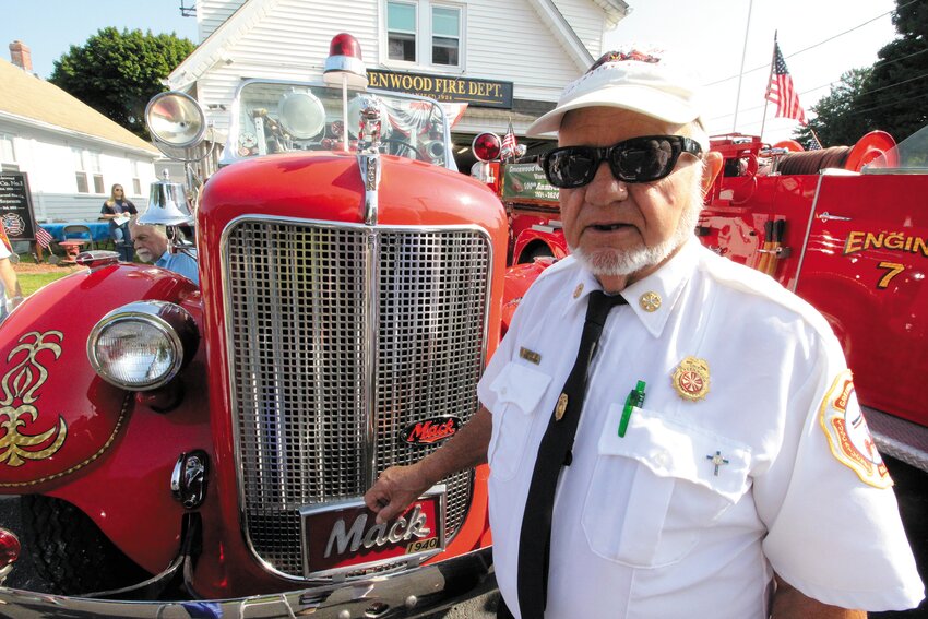 HE GAVE IT NEW LIFE: Gene Cahoon, with some assistance, virtually singularly restored the 1940 Mack that is one of two operating apparatus owned by the Greenwood Volunteer Fire Museum.