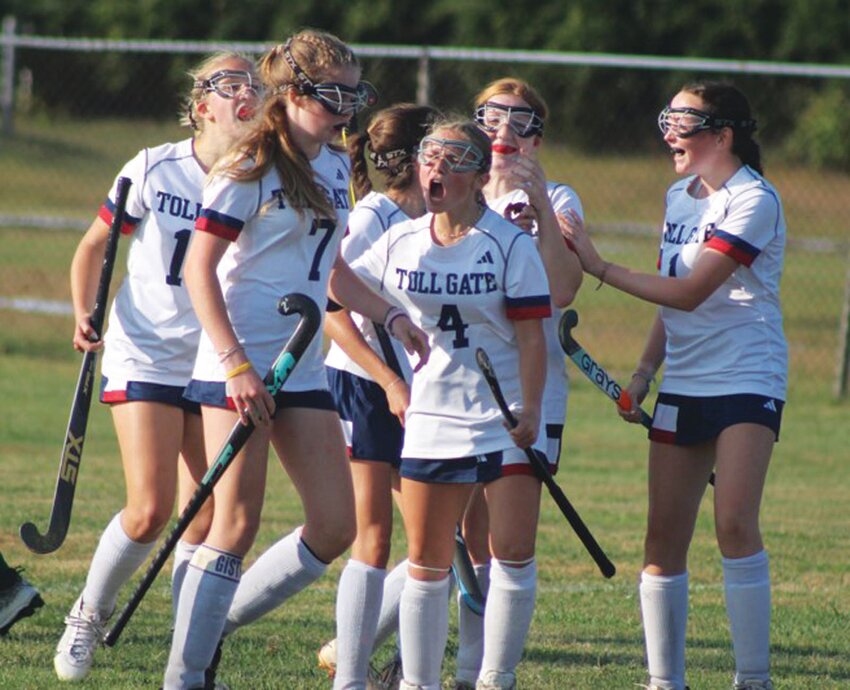 ON THE BOARD: Toll Gate players celebrate after scoring a goal against Cranston last week. (Photos by Alex Sponseller)