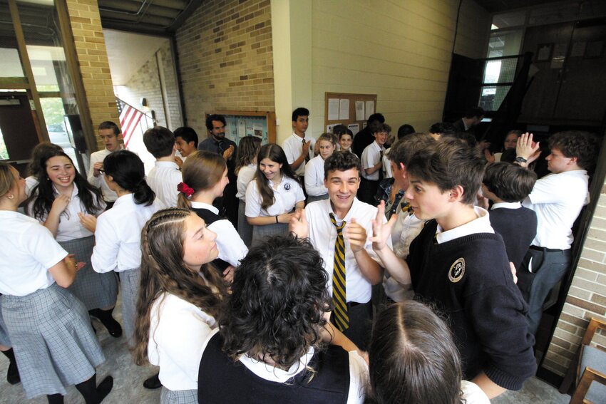 A SCHOOL IN A SCHOOL:  Academy students are divided into four schools that are awarded points for individual and group activities (points can also be removed). Standings are announced weekly and tallied for the academic year.  Here students celebrate following announcement of the totals. (Warwick Beacon photos)