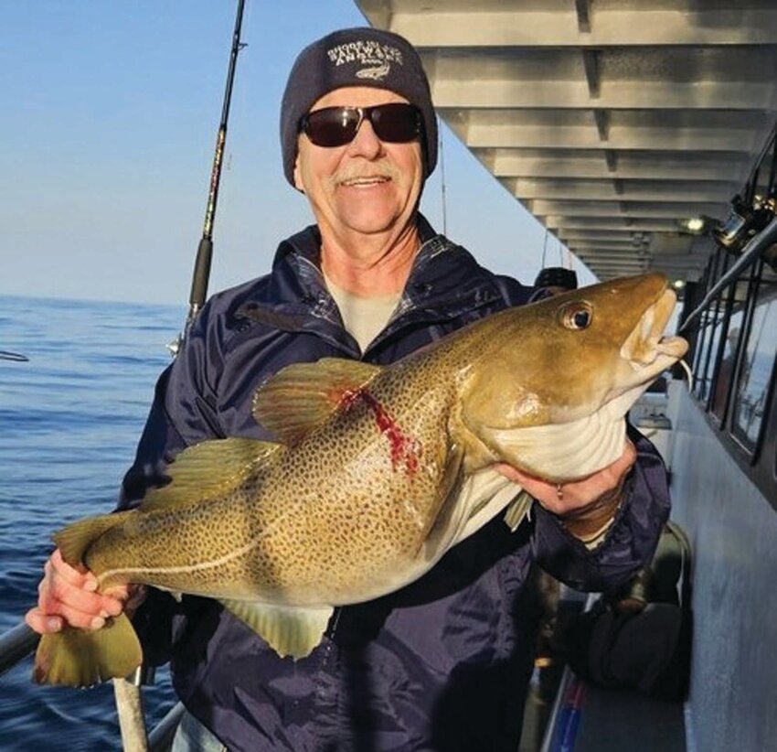 TAUTOG BITE: Rich Hittinger of Warwick with the 12 pound cod he caught Saturday fishing on the Capt. John (part of the Helen H party boat fleet) out of Hyannis, MA. (Submitted photos)