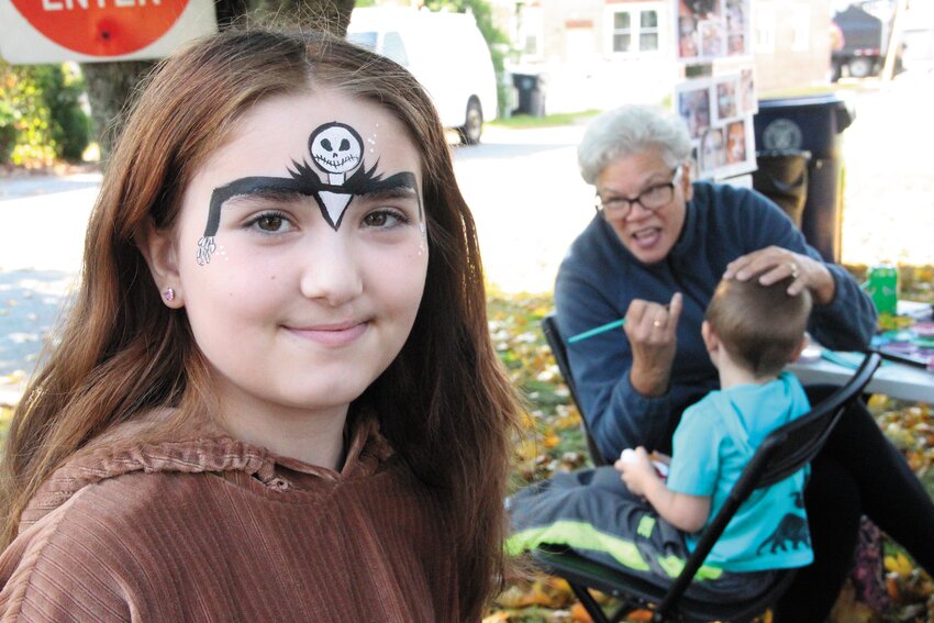 SCARY FACES: Art works were in the making including some face painting in advance to Halloween. Here Destiny Griffin shows off the work of Sue the Face Painter while her brother, Markie, gets his turn. Whether they will last until Halloween, however, remains to be seen.