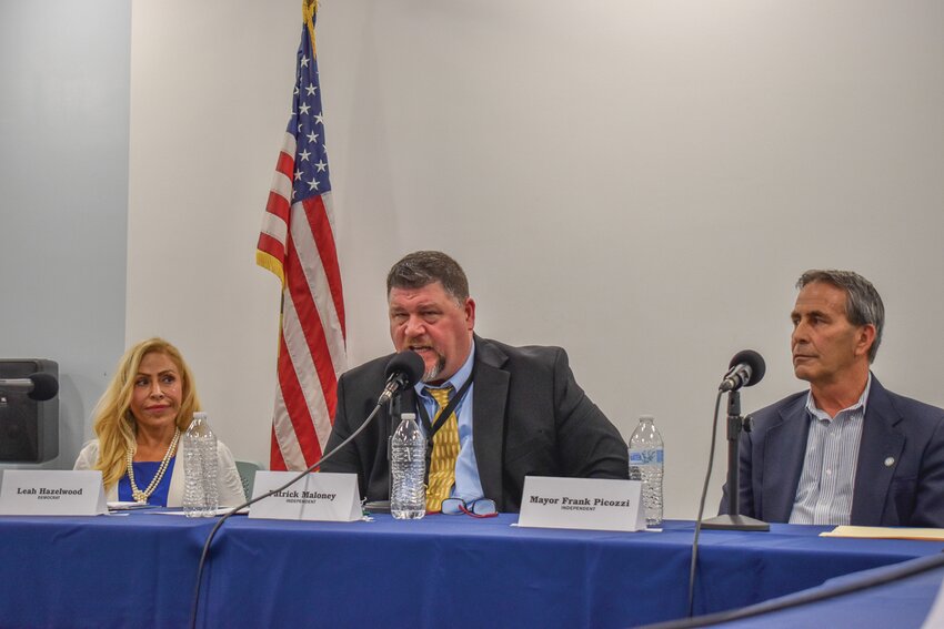 THE FIELD: Independent Warwick mayoral candidate Patrick Maloney, Jr., center, gives his closing statement at a debate inside the Warwick Public Library on Oct. 10, 2024. To his left: Democrat Leah Hazelwood. To his right: Incumbent Independent Mayor Frank Picozzi, who is seeking a third term in office.