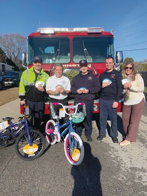 Christmas came a little early to Winsor Hill Elementary School with the Fire Department dropping off toys and gift cards for families who need a helping hand.  From left to right: Firefighter Patrick Brockway, Asst. Chief Richard Boehm, Firefighter Thomas Balkun, Fire Lt. Derek LaFazia and teacher Dina Needham.