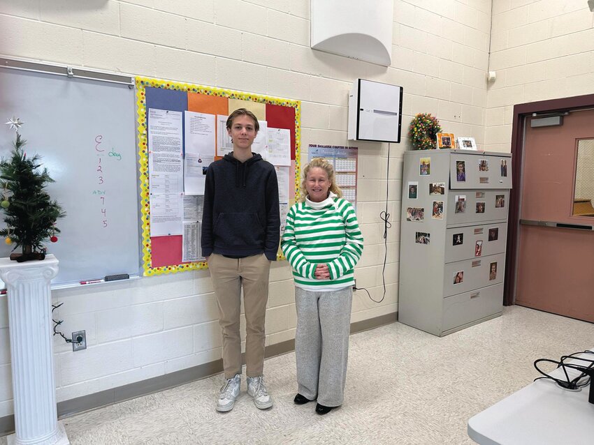 Jonah Johnston, one of 19 finalists nationwide in a campaign sponsored by the American Bankers Association, with Sharon Bowen, who teaches at the Business Academy of  Marketing and Management at the Warwick Area Career and Technical Center.