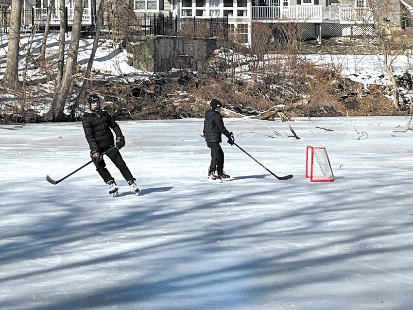 The skaters took turns slapping pucks into the net while on February vacation.