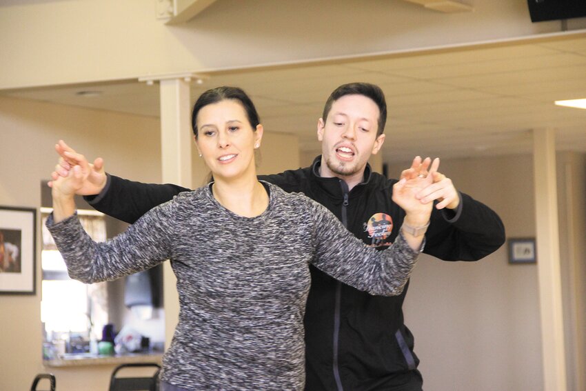 Derrick Powers of The Dancing Feeling is in the swing with Sabrina Antonelli, Warwick Norwood School Principal and Rhode Island Principal of the Year as they practice for the 18th edition of Dancing with the Stars of Mentoring.