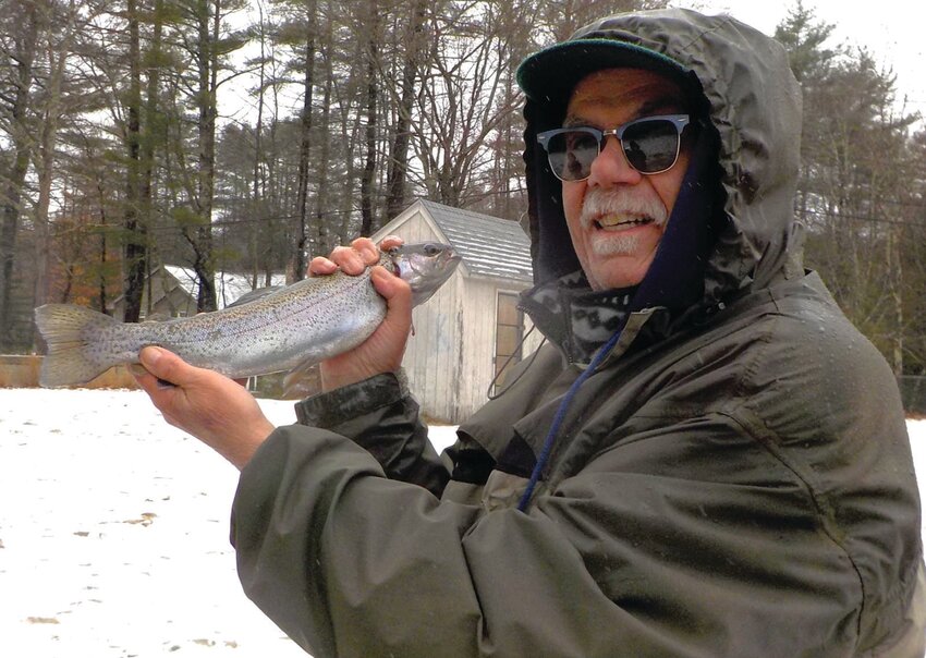 Gary Vandemoortele with a 14-inch rainbow trout caught at Spring Gove Pond, Chepachet on a cold and snowing Opening Day Saturday. Submitted photo