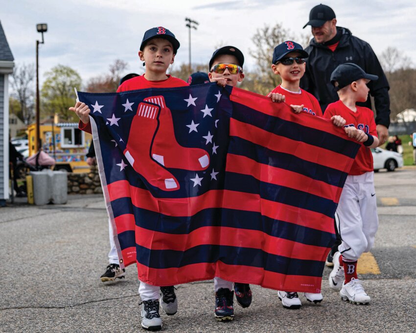 Members of the Red Sox walk in the parade.