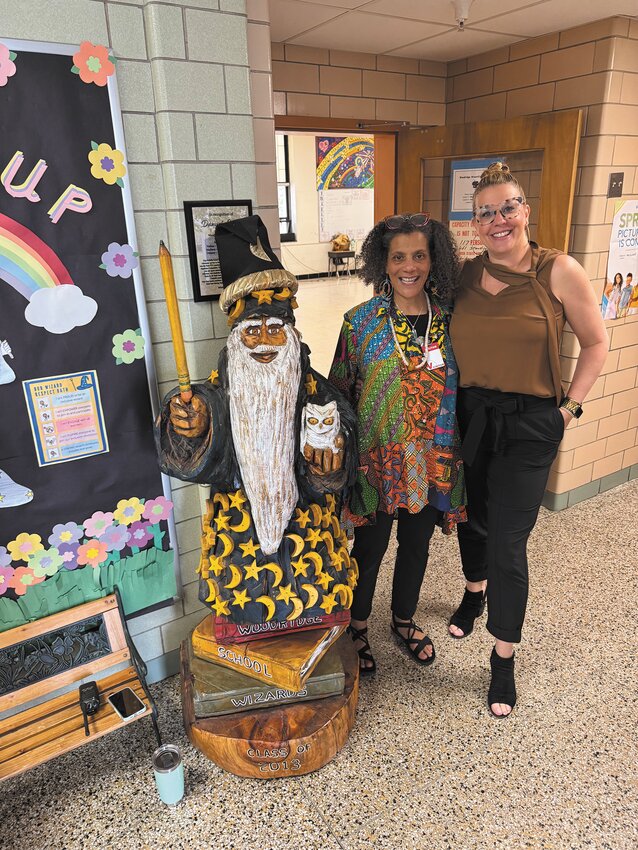 Storyteller Valerie Tutson with Principal Marisa Jackson.