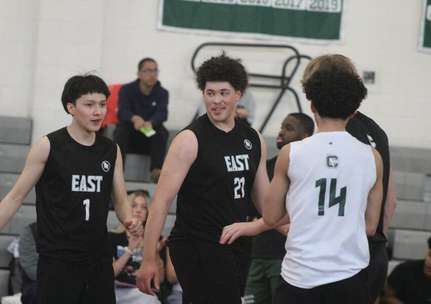 The Cranston East boys volleyball team celebrates after scoring a point. Beacon Media photos by Alex Sponseller