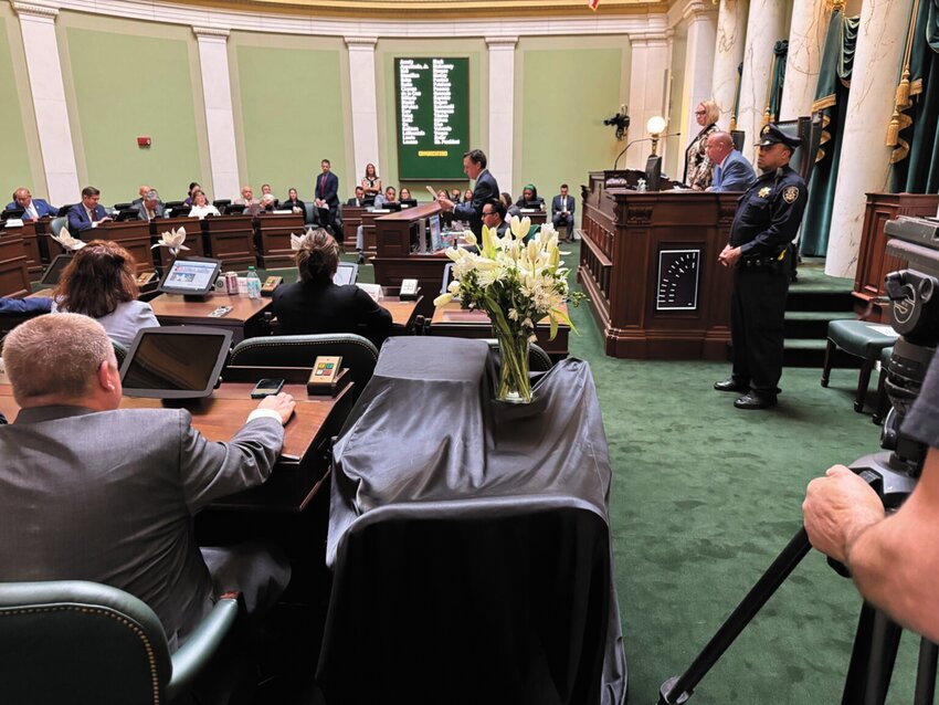 Flowers adorn the State House Senate seat of the late Rhode Island Senate President Dominick Ruggerio, who died April 21. Ruggerio reported more than $148,000 cash on hand in his campaign account as of March 31.