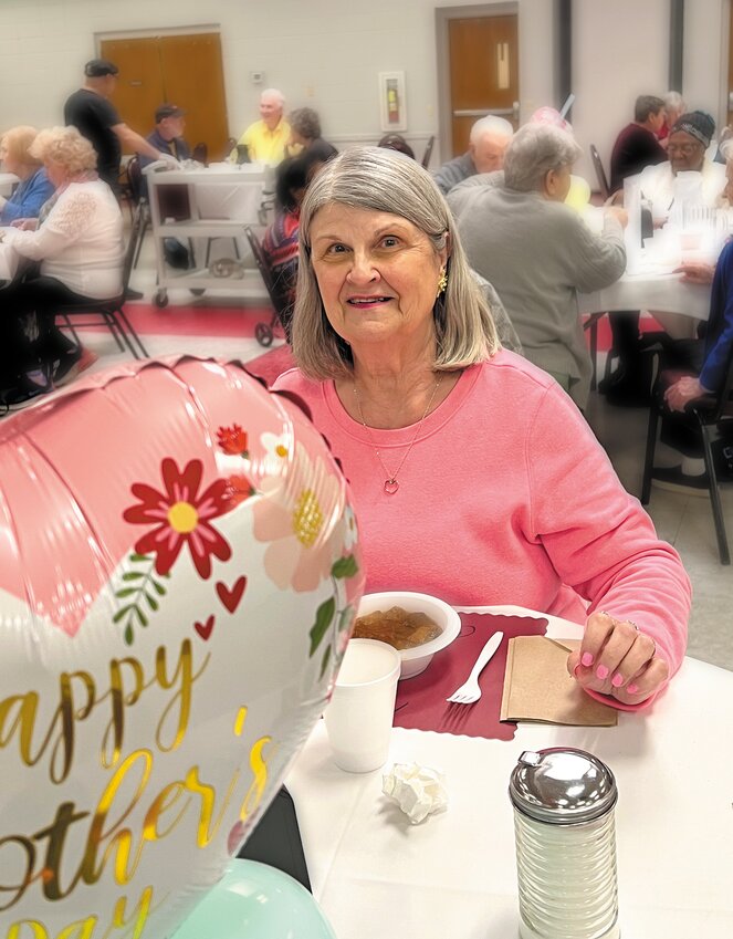 Candace Gauvin enjoys the lunch which included blueberry cake for dessert.