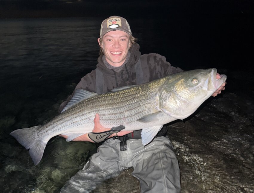 Grant Stark with the 46” striped bass he caught on Cape Cod last week. Photo courtesy of “My Fishing Cape Cod.”