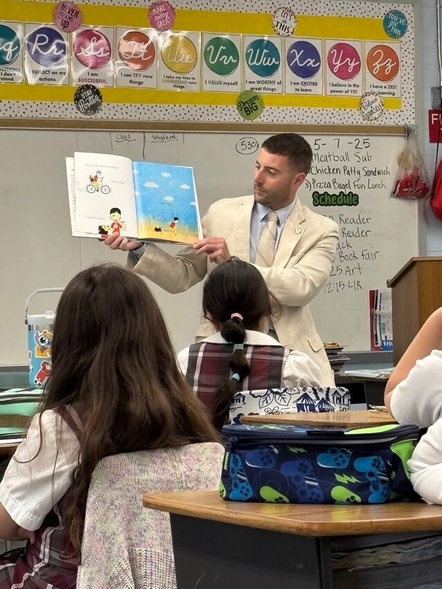 State Senator Andrew Dimitri, a 2006 graduate of&nbsp;St.&nbsp;Rocco&nbsp;School recently returned to participate in the school&rsquo;s Reading Week program.