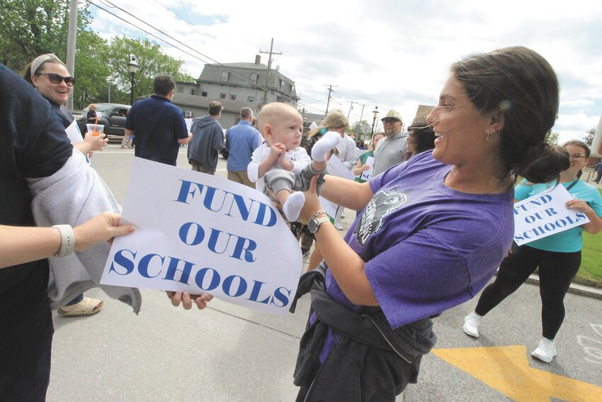 Teachers, school aides and maintenance staff greeted members of the City Council on Monday as they showed up for the budget hearing. The youngest of the bunch &ndash; perhaps a future Warwick student &ndash; was Egan Carroll in the arms of his aunt, Kendra Silvia.  Beacon Media photos by John Howell