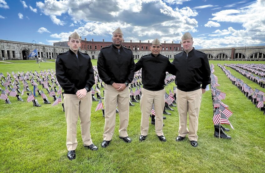 Four officers from the Navy Officer Development School in Newport spend time at the memorial. From left, Zachary Drake, Bill Drake, Wayne Forton and David Dereyfus.