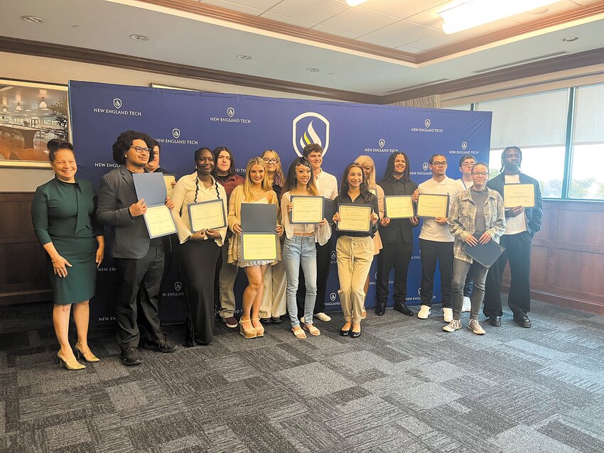 Rhode Island Commissioner of Elementary and Secondary Education Ang&eacute;lica Infante-Green, left, with some of the local high school seniors who recently completed the New England Institute of Technology&rsquo;s Early College Program to earn college credit during their last year of high school.