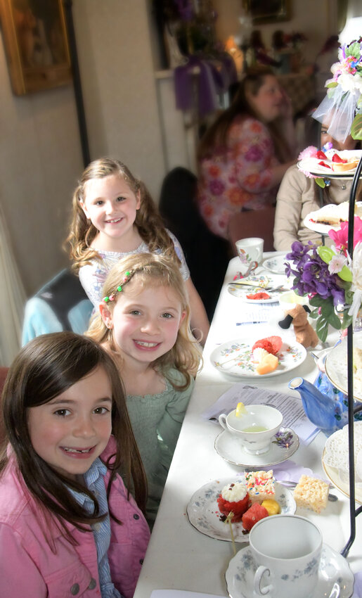 Friends. Sharing a love of American Girl Dolls and some of life's finer things &ndash; like an afternoon tea &ndash; are, from left, Emma Dughan, Ella Thompkins and Graysen Field.
