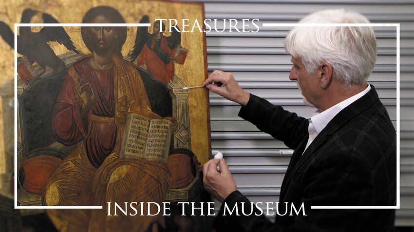 Anthony Moore, a conservator with Northeast Painting Conservation examines an Icon at the Icon Museum and Study Center in Clinton, MA to determine how much work will be needed to conserve a new acquisition.