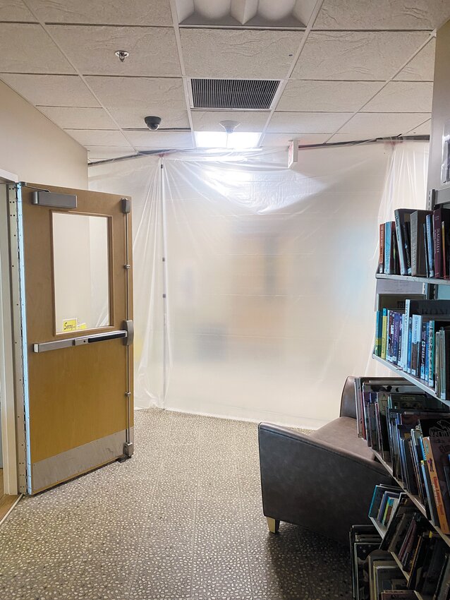 Submitted photo from Director Jon Anderson showing the flood damage and restoration efforts in the library&rsquo;s lower levels.