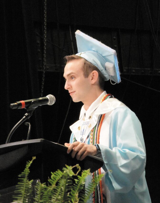 Valedictorian Lucas Anderson encourages his classmates to “write their own stories” as they move to the next chapter of their lives.