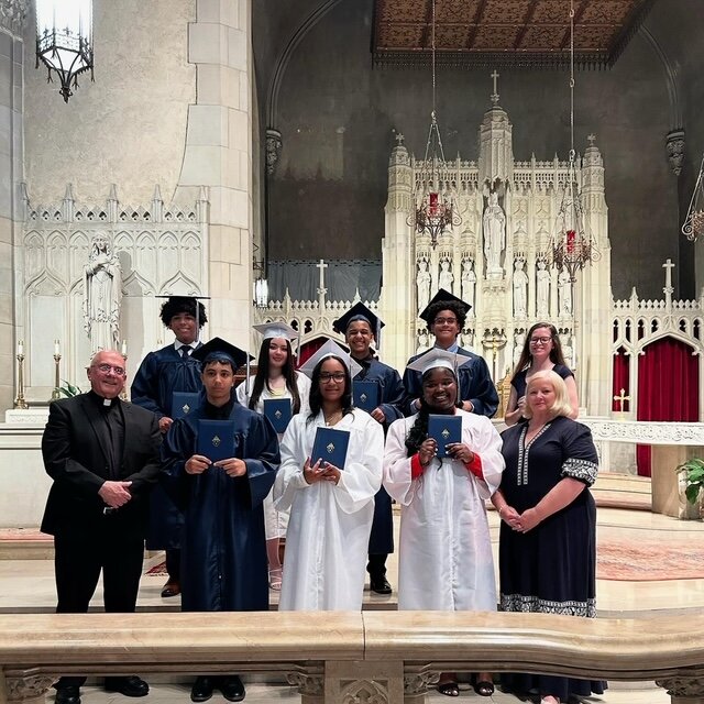 From left, Abraham Espinal and his brother Matthew Espinal were both graduates at St. Paul last week – from eighth grade and kindergarten, respectively.