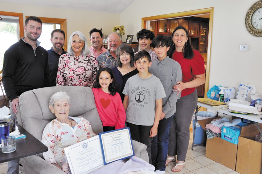 Rose Susi surrounded by her family as well as Senator Andrew Dimitri and Councilmember Lauren Garzone.