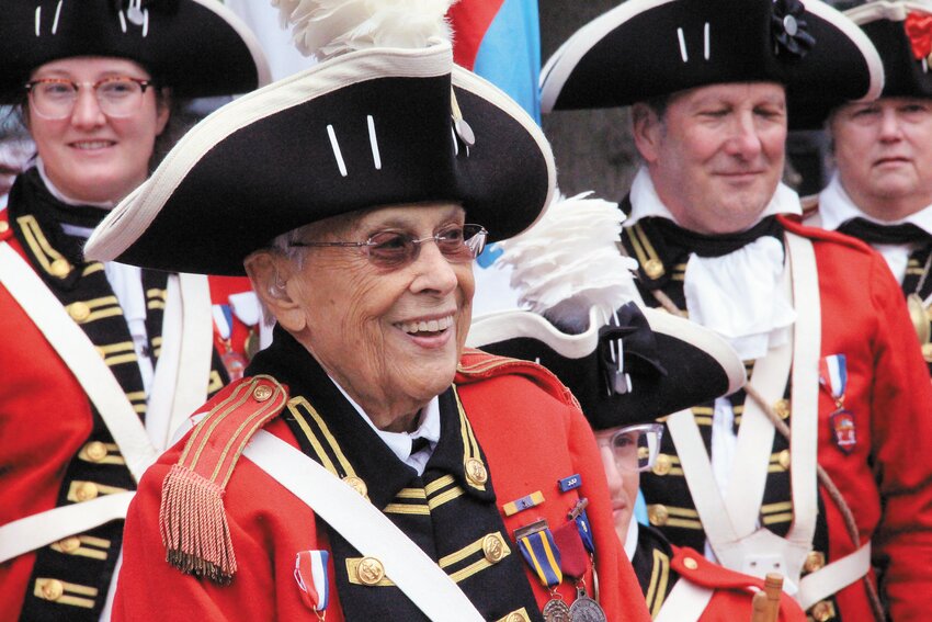 Not that they are known as a chorus, the Pawtuxet Rangers sang happy birthday to Jeanne Knowles before stepping off to lead the Gaspee Days parade on Saturday. Jeanne celebrated her 99th birthday on Sunday. Beacon Media photo by John Howell