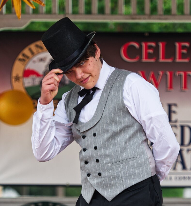 Ben Williams tips his hat to the judges and crowd, showing off his 1920s outfit.