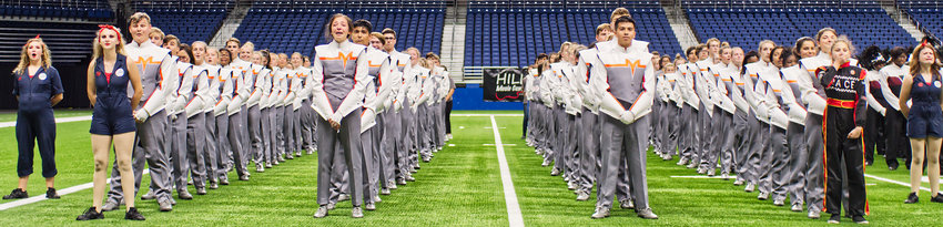 Mineola High School Sound of the Swarm marching band members react to being named the back-to-back state marching competition champions at the Alamodome in San Antonio in November.