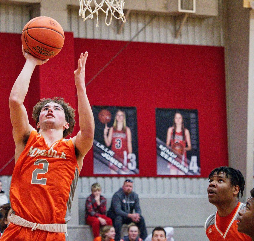 T.J. Moreland adds two to Mineola's tally. He recently surpassed 1,000 points in his Yellowjacket career. [more hoops highlights here]
