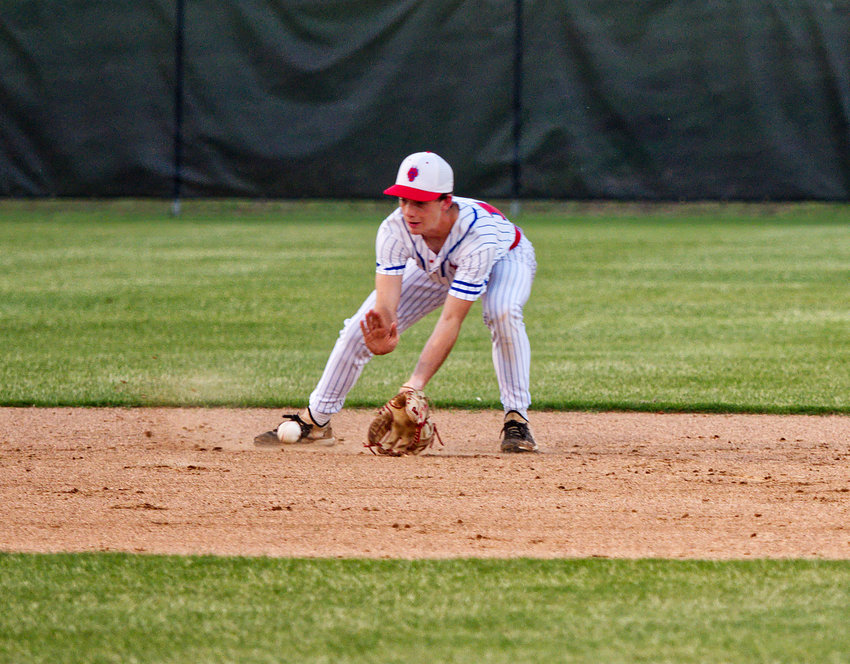 Alba-Golden shortstop Easton Campbell fields a grounder in Friday&rsquo;s first game of the two-game playoff with Rivercrest.