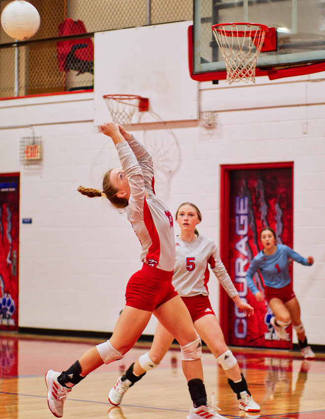 Cacie Lennon saves the ball back toward the net after her teammates helped chase it down. The Lady Panthers swept Winona 3-0 last Tuesday.  [view more volleyball shots]