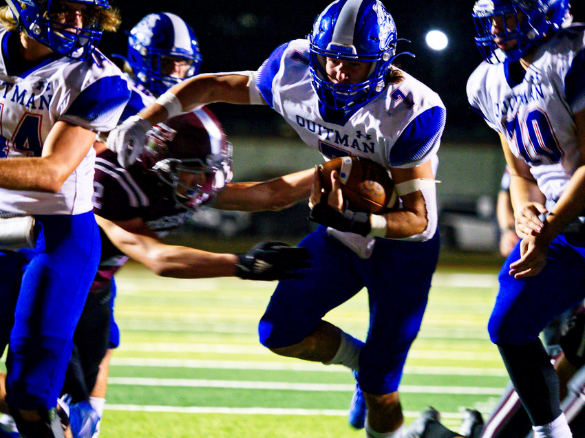 Carson Dickens scores Quitman’s lone touchdown in the Bulldogs’ 63-6 defeat at the hands of Troup Friday.