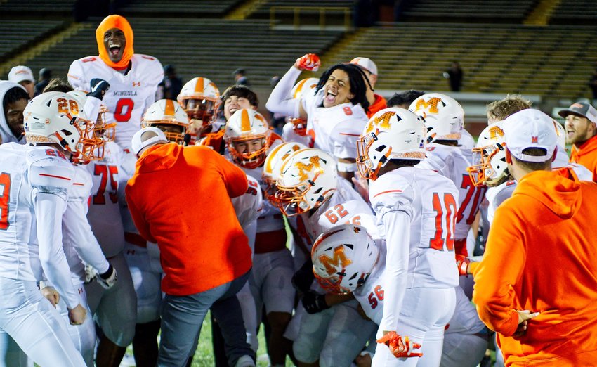 After completing a second-half comeback to clinch the fourth and final district playoff spot, Mineola players celebrate Saturday night in Commerce.