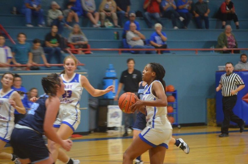 Quitman&rsquo;s Allie Berry drives the lane and scores two of her game high 12 points in the Lady Bulldog&rsquo;s 39-30 win to open the season last Tuesday evening.