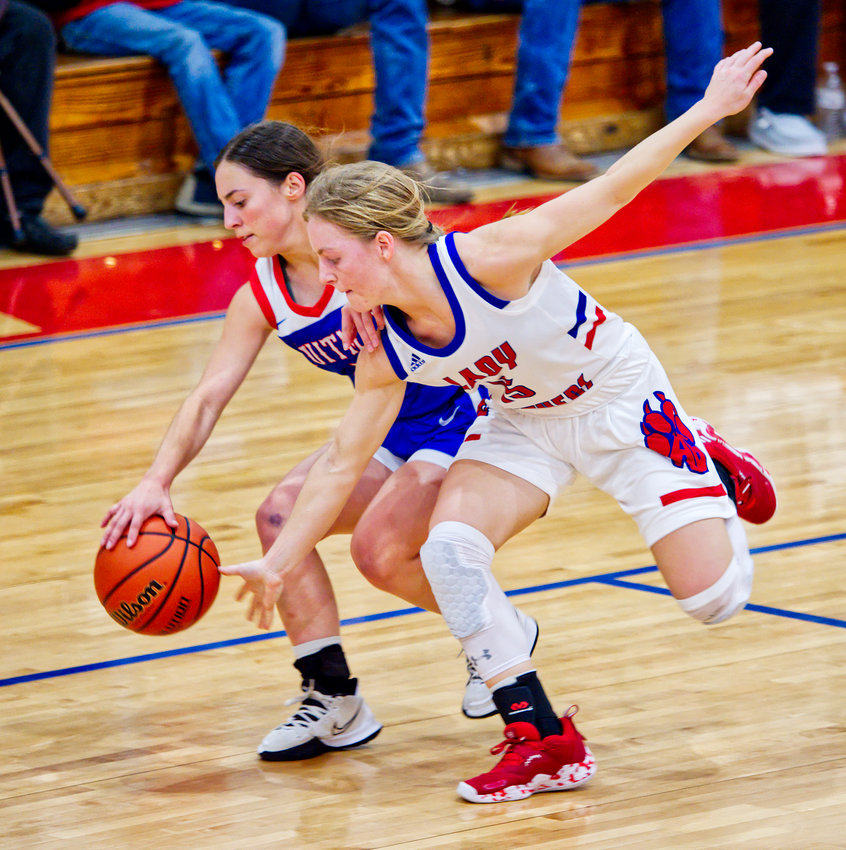 Quitman's Addison Marcee and Alba-Golden's Cacie Lennon compete to gain possession of the ball.