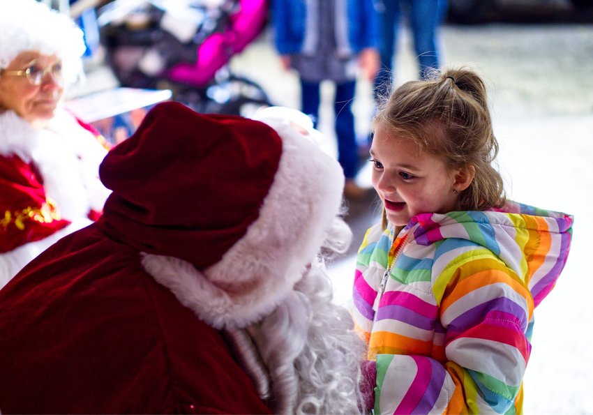 Kenley Deraad of Hawkins lets Santa know what she wants for Christmas at Quitman's 3rd annual Hometown Christmas event.