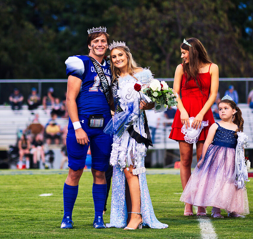 Newly-crowned 2023 Quitman homecoming king and queen Mikey Pickering and Hannah Holland after being crowned by the previous queen, Kameran Farnham, and attendant Sawyer Osbourn.