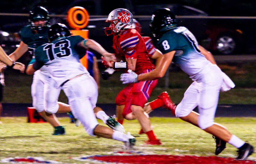 Peyton Dickinson slices through the Boles defense for 58 yards and a score, giving the home side a 21-3 lead with 3:35 left in the half. 