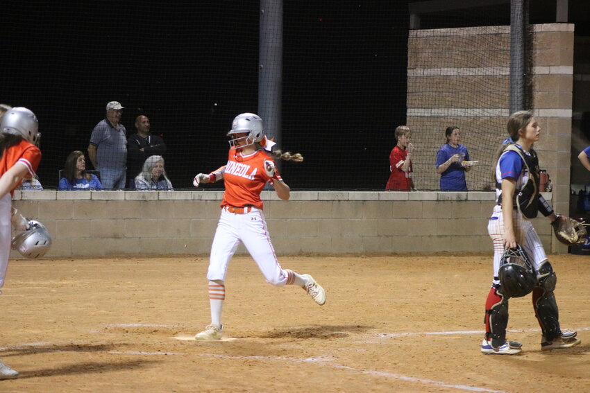 Quitman catcher Larkin Spears waits for a throw as Mineola scores another run in last week&rsquo;s 11-1 district victory by the Lady Jackets.