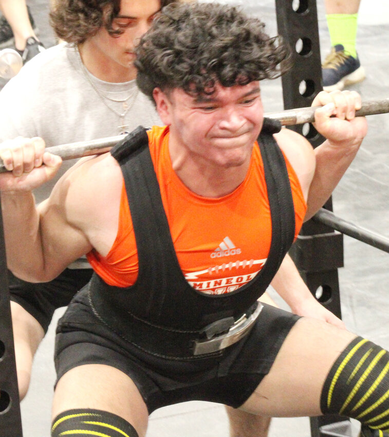 Moses Medellin of Mineola competes in the regional power lifting meet, winning the 181-pound class to advance to state.
