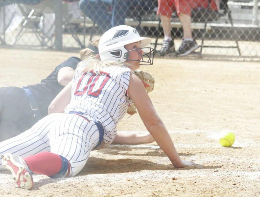 In a cloud of dust, Lady Panther Kayleigh Logan scored with a heads-first slide in the win over Fruitvale.